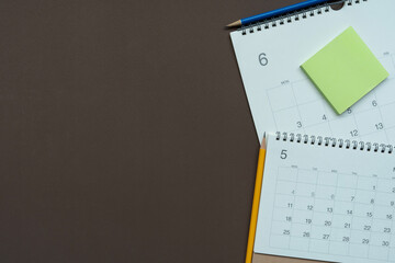 close up of calendar on the brown table background, planning for business meeting or travel...