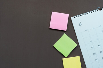 close up of calendar on the brown table background, planning for business meeting or travel...