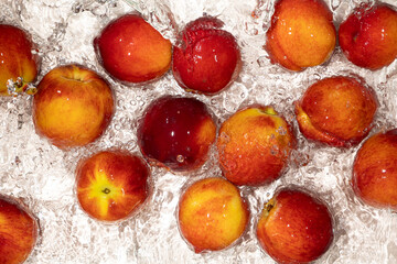 Vibrant Peaches in Water with Splash. Summer Fruit Scene.
