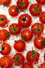 Water Burst Around Fresh Tomatoes Overhead Angle