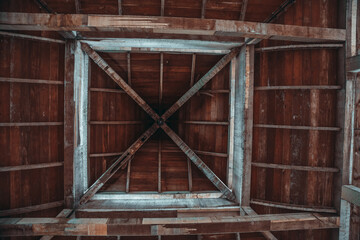 Wooden roof in an abandoned hotel. Roof with holes.