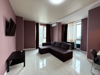 Spacious living room with corner sofa and panoramic windows