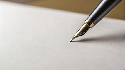 Close-up of a fountain pen tip poised over blank paper, ready for writing or drawing.