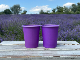 Lavender paper cup with coffee. Time to drink coffee. Coffee to go. Enjoy the moment, take a break....