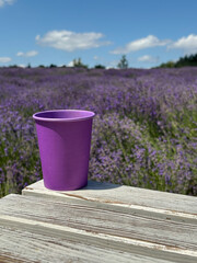 Lavender paper cup with coffee. Time to drink coffee. Coffee to go. Enjoy the moment, take a break....