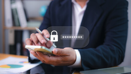 Cybersecurity concept with businessman holding smartphone and password login key icon. Online...