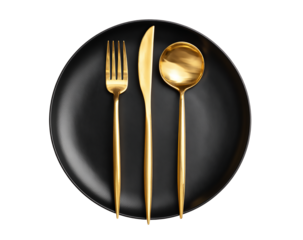 Golden cutlery set arranged on a black plate is isolated on transparent background, creating an elegant and modern dining setting