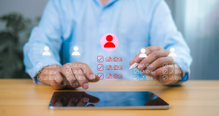 Recruitment process with businessman selecting candidate profile on tablet. Human resource...