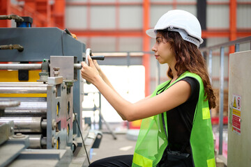 Engineer or worker checking machine control in the factory