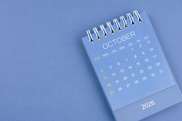 October 2026 calendar on blue color background. Desk calendar for planning and organizing.