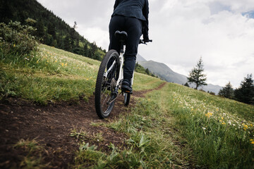 Riding mountain bike on grassland forest mountains