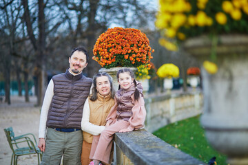 Happy family of three, father, mother and daughter enjoying family time together in Luxembourg...