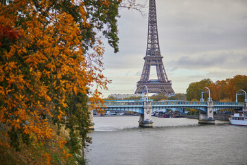 Scenic view to the Eiffel tower over the river Seine on a nice autumn day in Paris.