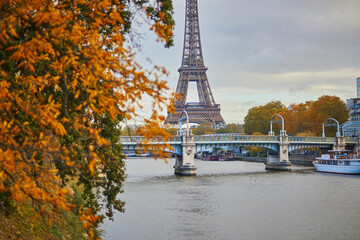 Scenic view to the Eiffel tower over the river Seine on a nice autumn day in Paris.