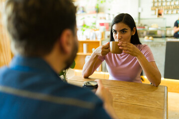 Couple enjoying coffee and conversation in cafe