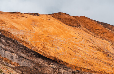 A volcanic landscape with desert and rocky mountains.