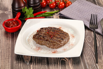 Grilled beef burger cutlet with sauce