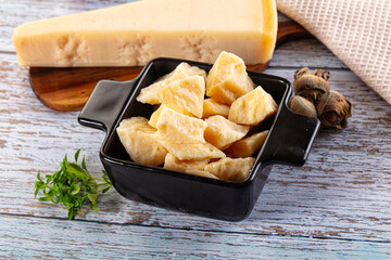 Parmesan cheese pieces in the bowl