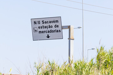 Road sign pointing to sacavem freight station in portugal