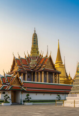 Fototapeta premium Wat Phra Kaew and Golden Pagodas at Grand Palace in Bangkok, Thailand