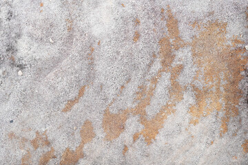 Grey flintstone pebbles with yellow stains texture