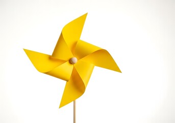 A yellow paper pinwheel isolated on white background