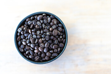 Roasted coffee beans on wood table