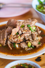 Thai pork neck and herbs salad, is a popular traditional Thai food of Thailand. Spicy Minced Pork Salad is also called Pla Moo.