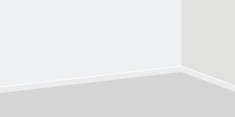 A simple view of a white room with a gray floor and white walls meeting at corner