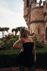 A beautiful lady walking through the grand halls of an ancient castle