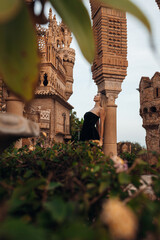 A beautiful lady walking through the grand halls of an ancient castle
