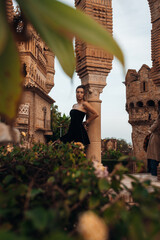 A beautiful lady walking through the grand halls of an ancient castle