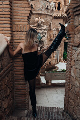 A beautiful lady walking through the grand halls of an ancient castle