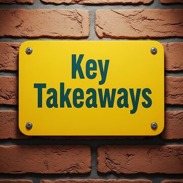 Yellow sign with key takeaways on brick wall