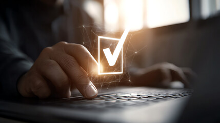 Person pressing a key on a laptop keyboard with a glowing checkmark symbol floating above, representing task completion or approval in a digital environment