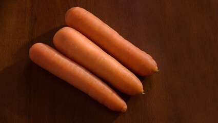  Carrots bunch of fresh organic vegetarian food on rustic wooden background. Rustic style and natural style 