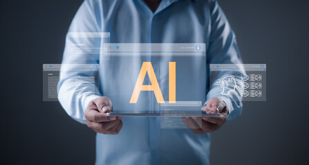 AI and artificial intelligence drive innovation as a businessman holds a tablet displaying data screens, representing machine learning and tech-driven digital transformation.
