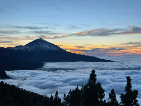 Mount Teide Overlooking a Sea of Clouds at Sunset &ndash; Dramatic Landscape on Tenerife with Glowing Sky, Striking Contrasts, and Volcanic Silhouette Above the Clouds in the Canary Islands