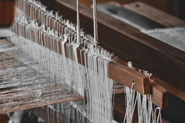 Close up image of a tapestry being created on an old loom