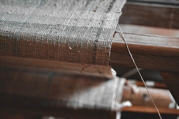 Close up image of a tapestry being created on an old loom