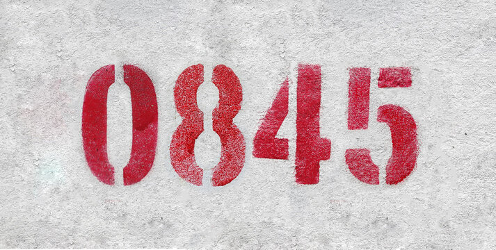 red spray-painted number 0845 sprayed onto a white wall.