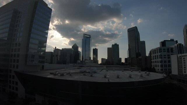 Charlotte, North Carolina, USA, June 23, 2025: TIMELAPSE - Uptown Charlotte at sunset, also called Center City, is the central business district of Charlotte.