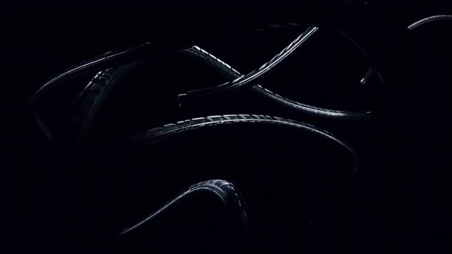 Abstract Octopus Tentacles: Mystical depiction of octopus tentacles in a dark, shadowy underwater, the image offers a sense of mystery, evoking curiosity.