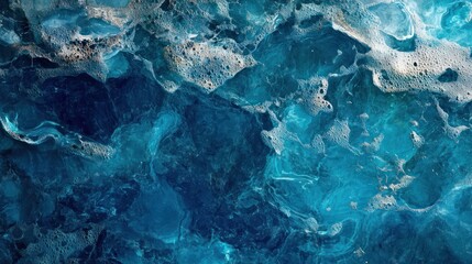 Abstract blue ocean texture with foam and swirls.