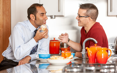 Gay Lifestyle: Sharing Breakfast. A same sex couple starting the day together enjoying breakfast. From a series of related images.