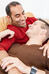 Gay Lifestyle: The Look of Love. A close and genuinely affectionate moment between a relaxed same sex couple. From a series of related images.