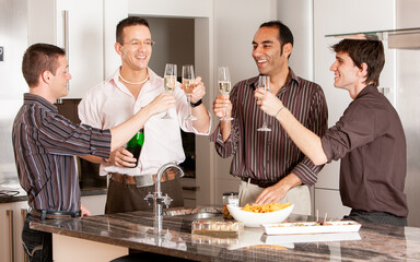 Gay Lifestyle: A Toast. A group of same sex friends celebrating and making a toast with a glass of champagne. From a series of related images.
