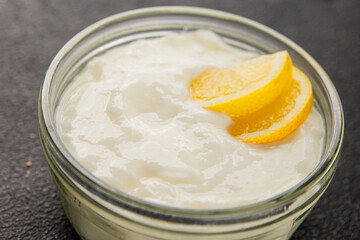 Lemon yogurt natural product skyr sour milk skir fresh delicious gourmet food background on the table rustic food top view copy space keto and paleo diet vegetarian food