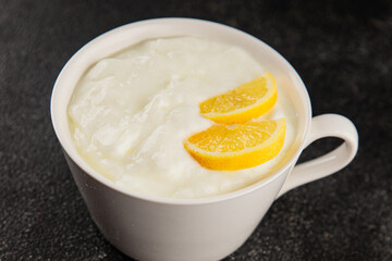 Lemon yogurt natural product skyr sour milk skir fresh delicious gourmet food background on the table rustic food top view copy space keto and paleo diet vegetarian food