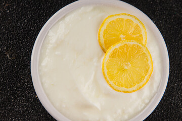 Lemon yogurt natural product skyr sour milk skir fresh delicious gourmet food background on the...